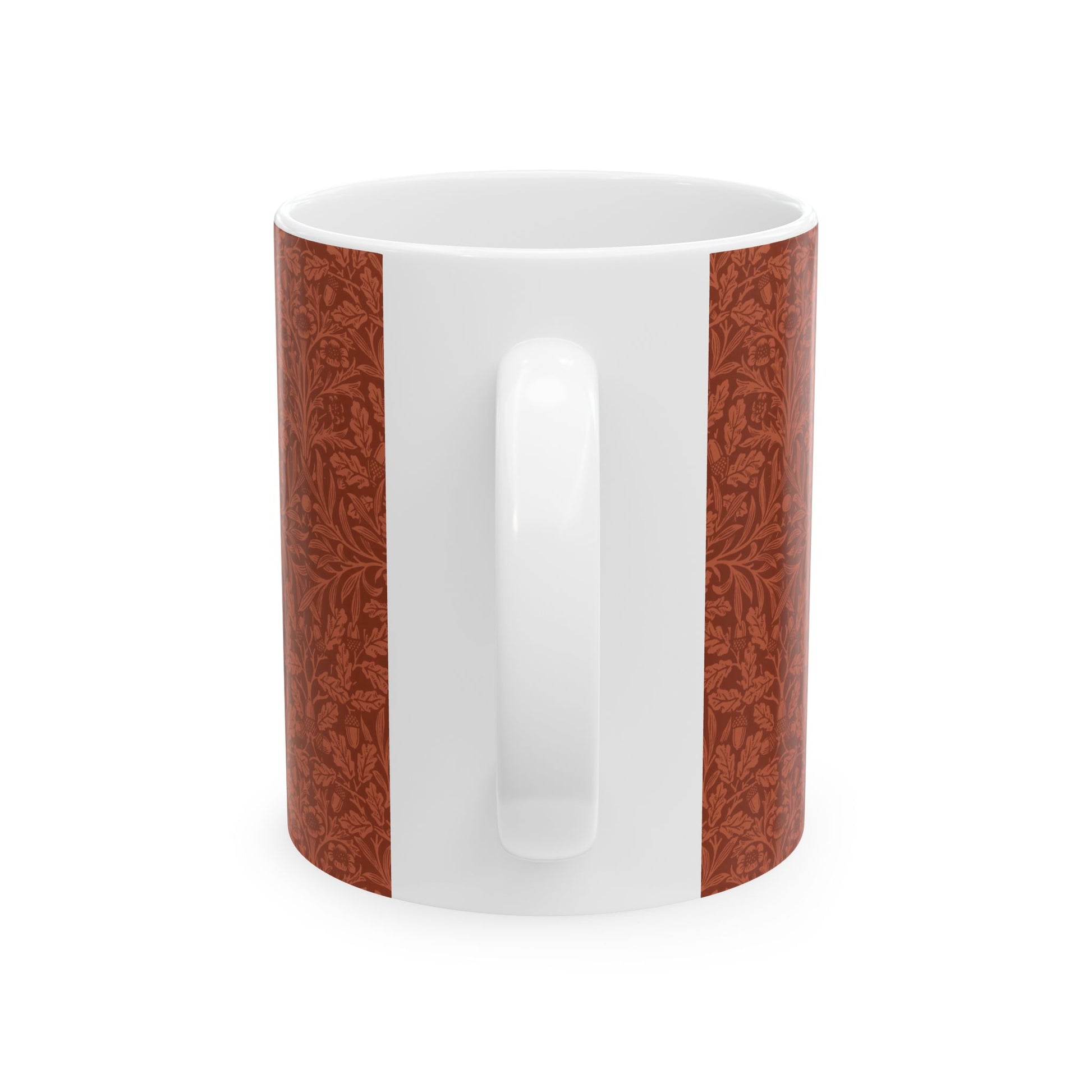 A ceramic mug with a rust-coloured floral pattern inspired by William Morris - Acorns & Oak Leaves Collection.