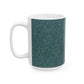 A ceramic mug with a teal base and a white handle featuring a floral and acorn pattern design, inspired by William Morris.