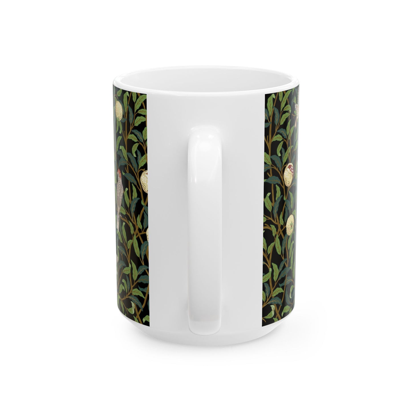 A ceramic mug with a black background featuring a floral William Morris & Co pattern of birds and pomegranates.