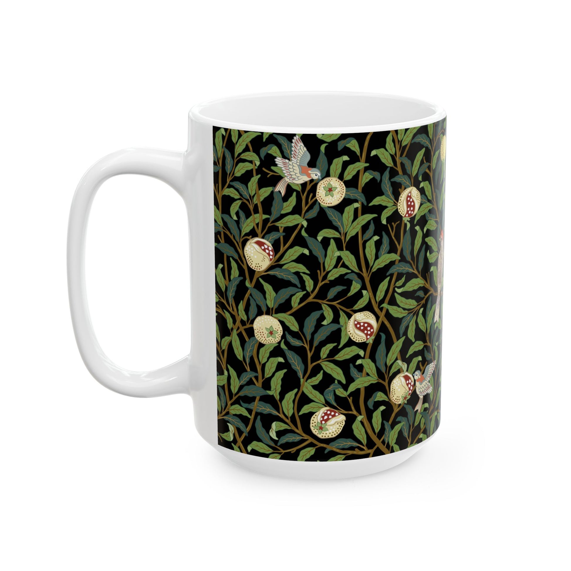 A ceramic mug with a black background featuring a floral William Morris & Co pattern of birds and pomegranates.