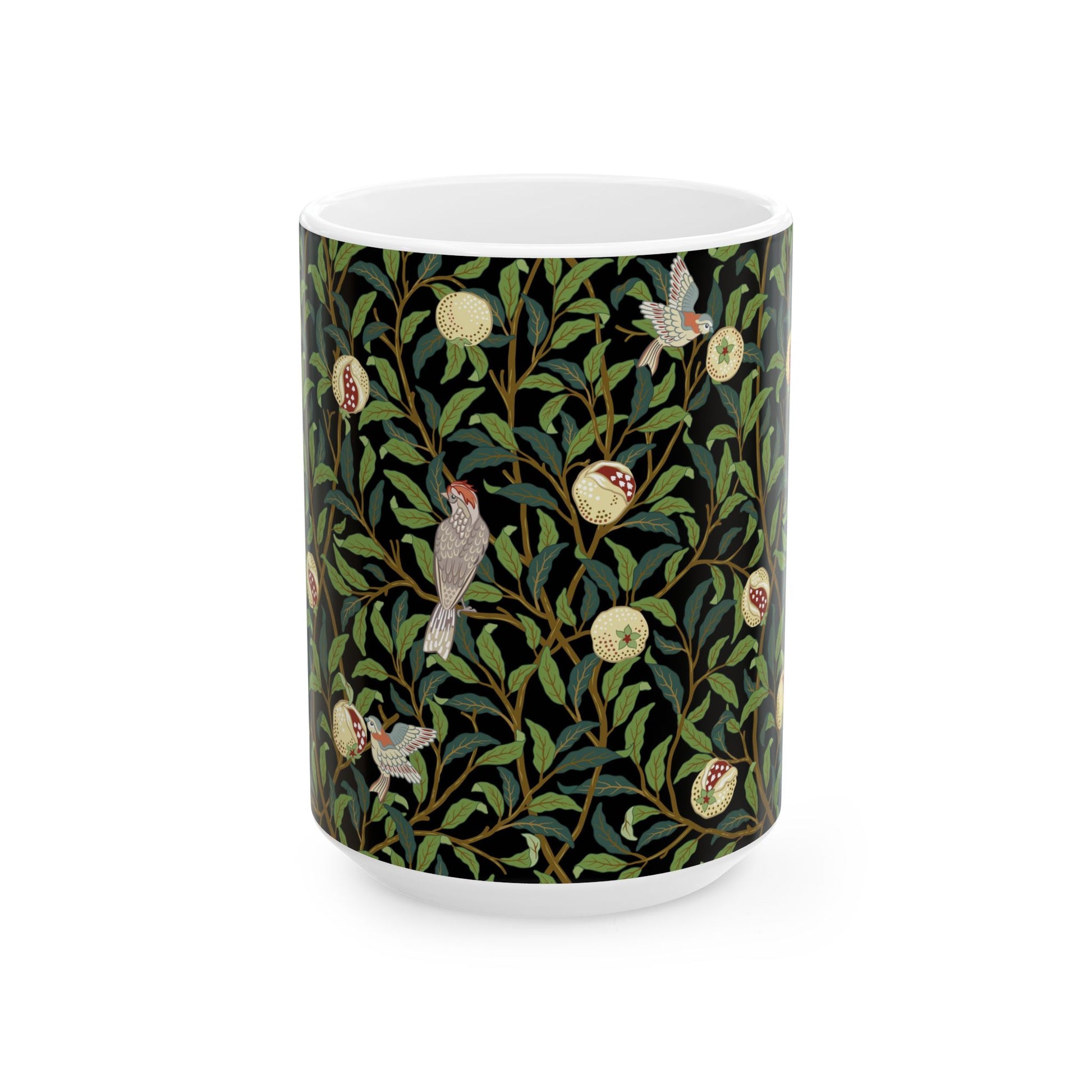 A ceramic mug with a black background featuring a floral William Morris & Co pattern of birds and pomegranates.