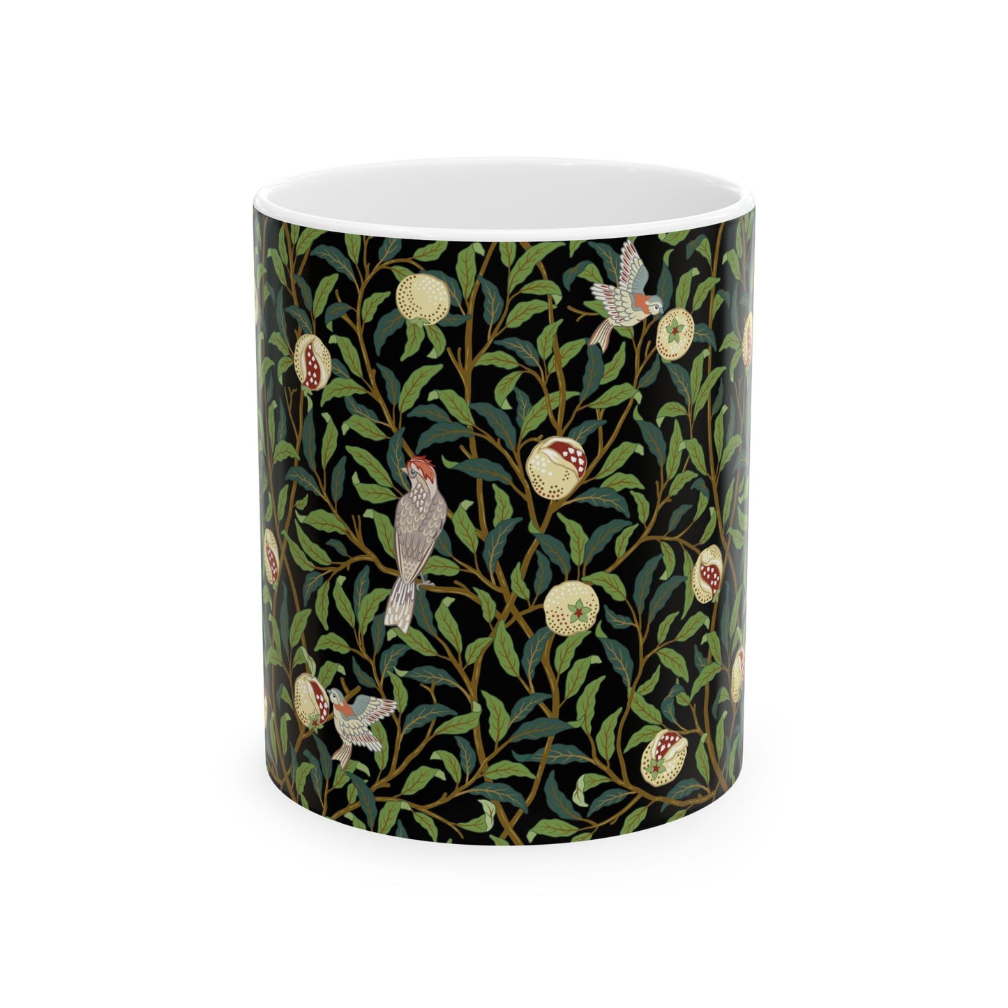 A ceramic mug with a black background featuring a floral William Morris & Co pattern of birds and pomegranates.