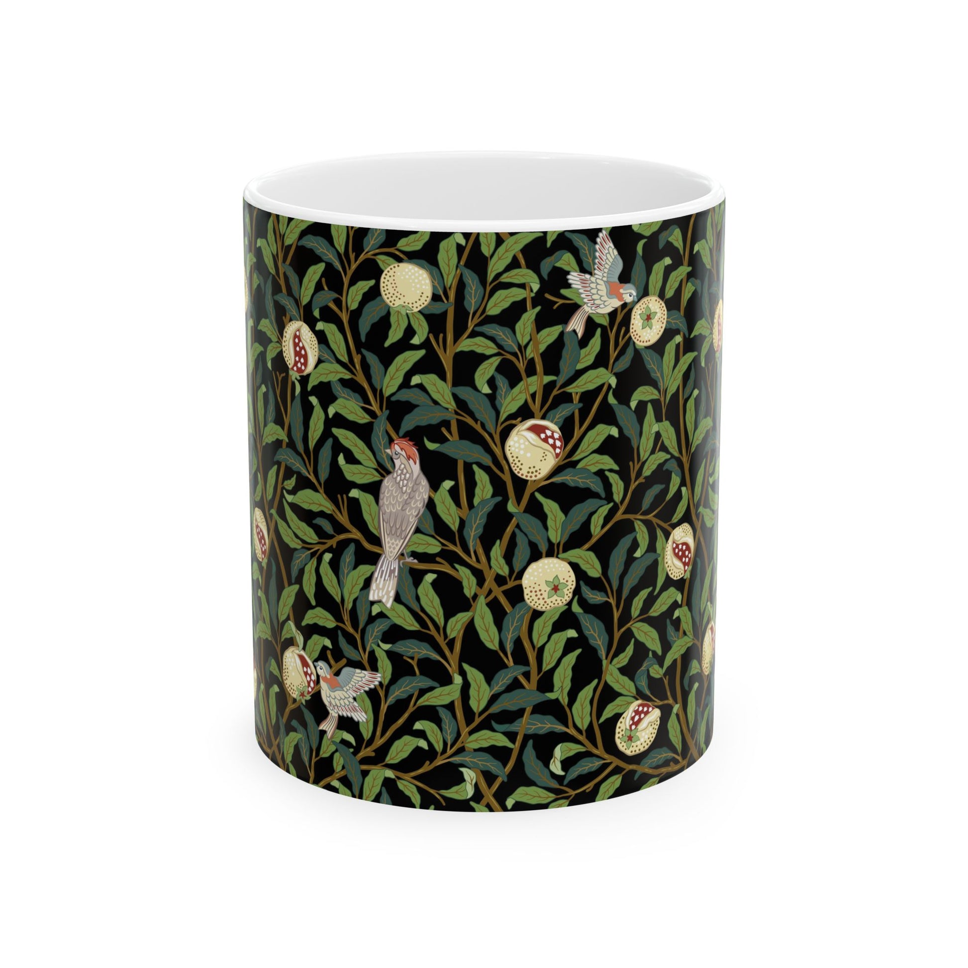 A ceramic mug with a black background featuring a floral William Morris & Co pattern of birds and pomegranates.