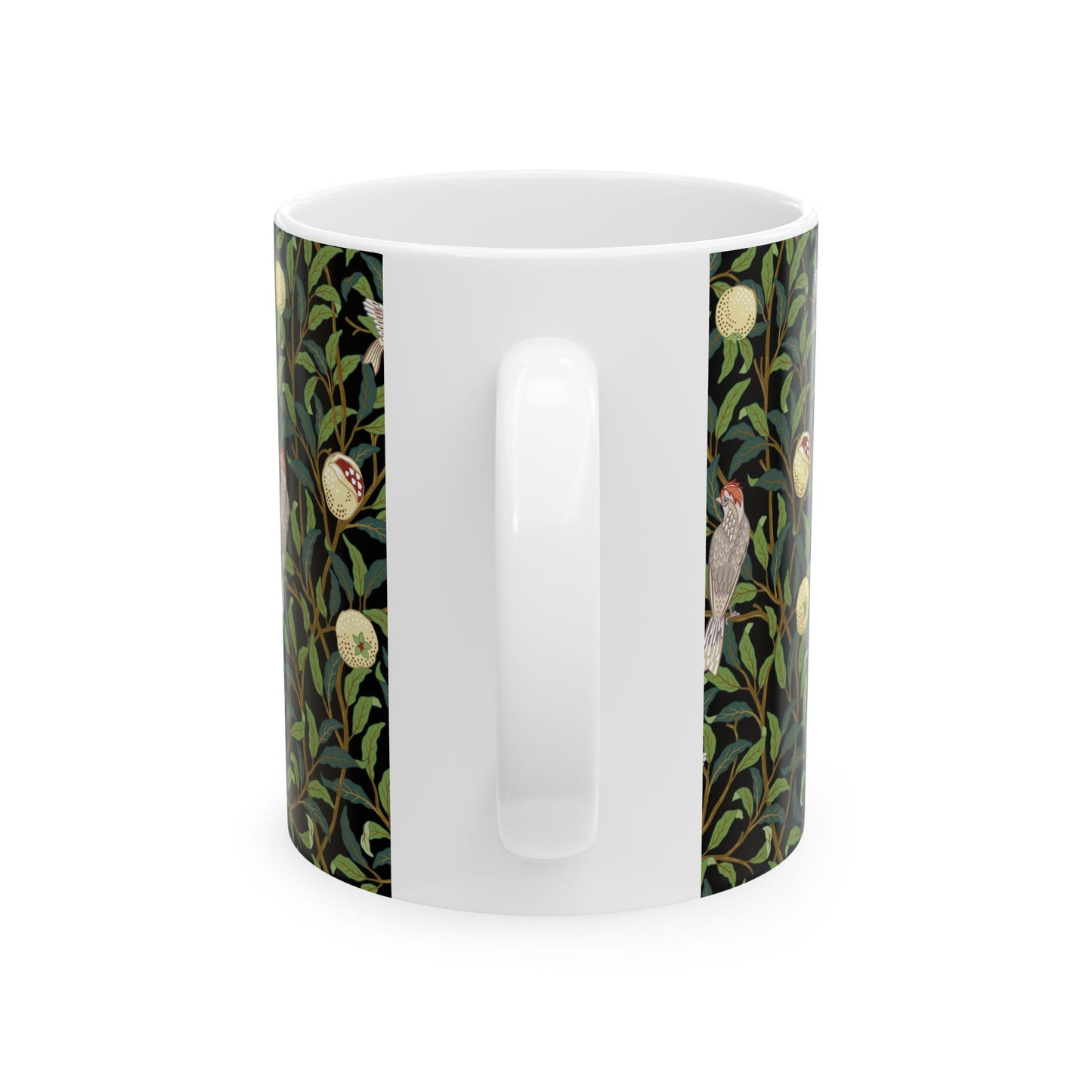 A ceramic mug with a black background featuring a floral William Morris & Co pattern of birds and pomegranates.