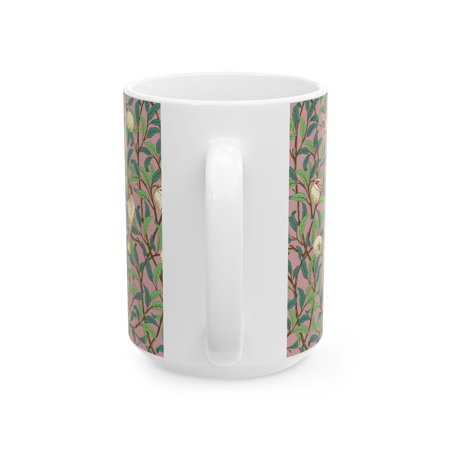 A white ceramic mug with a pink floral and pomegranate design inspired by William Morris.