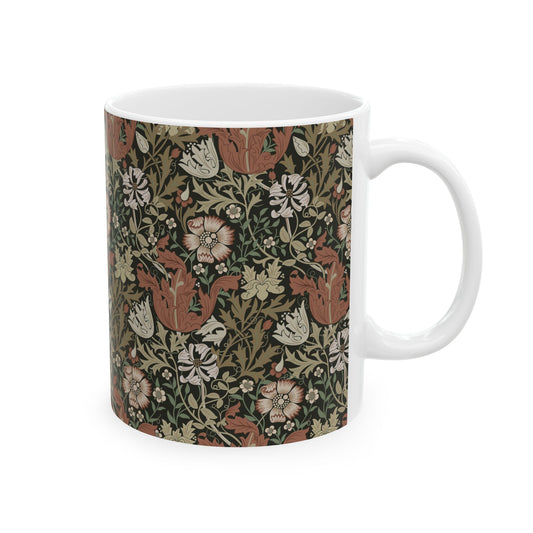 A white ceramic mug with a floral Arts & Crafts pattern called Compton which was inspired by William Morris & Co