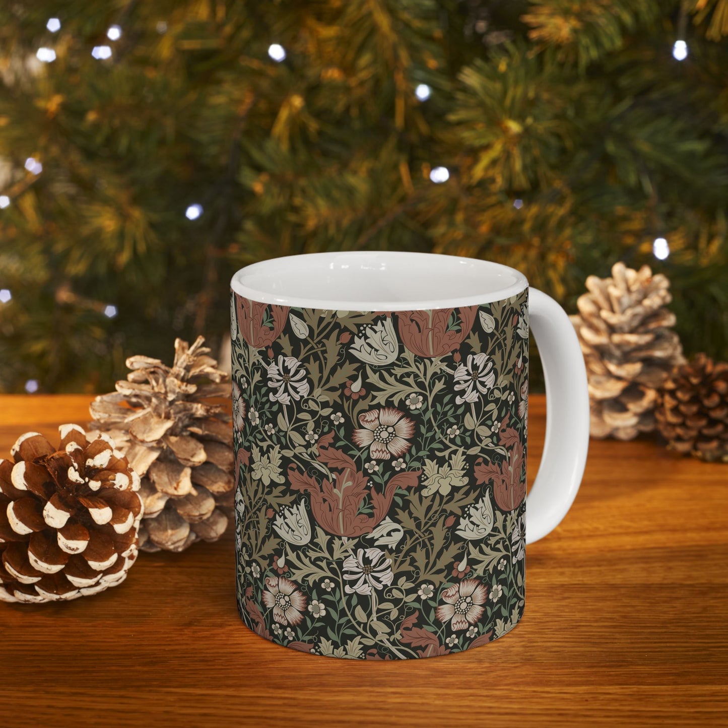A white ceramic mug with a floral Arts & Crafts pattern called Compton which was inspired by William Morris & Co