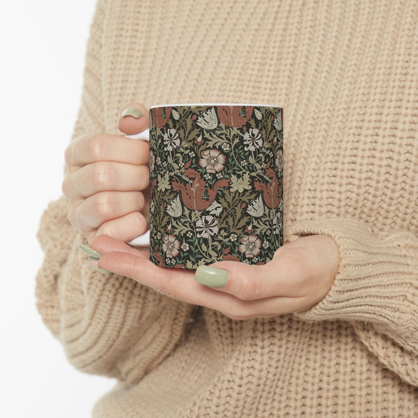 A white ceramic mug with a floral Arts & Crafts pattern called Compton which was inspired by William Morris & Co