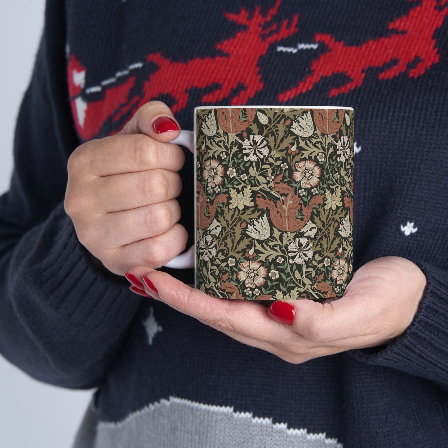 A white ceramic mug with a floral Arts & Crafts pattern called Compton which was inspired by William Morris & Co