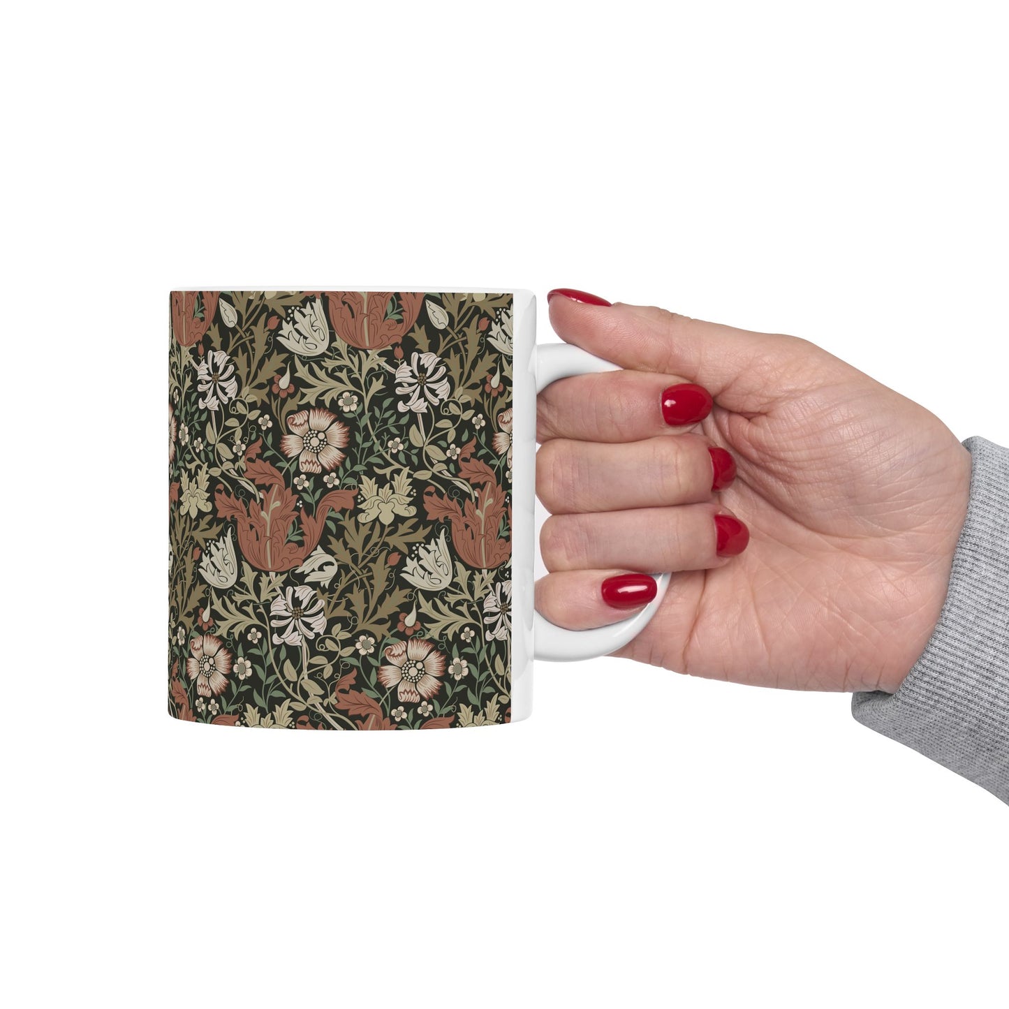 A white ceramic mug with a floral Arts & Crafts pattern called Compton which was inspired by William Morris & Co