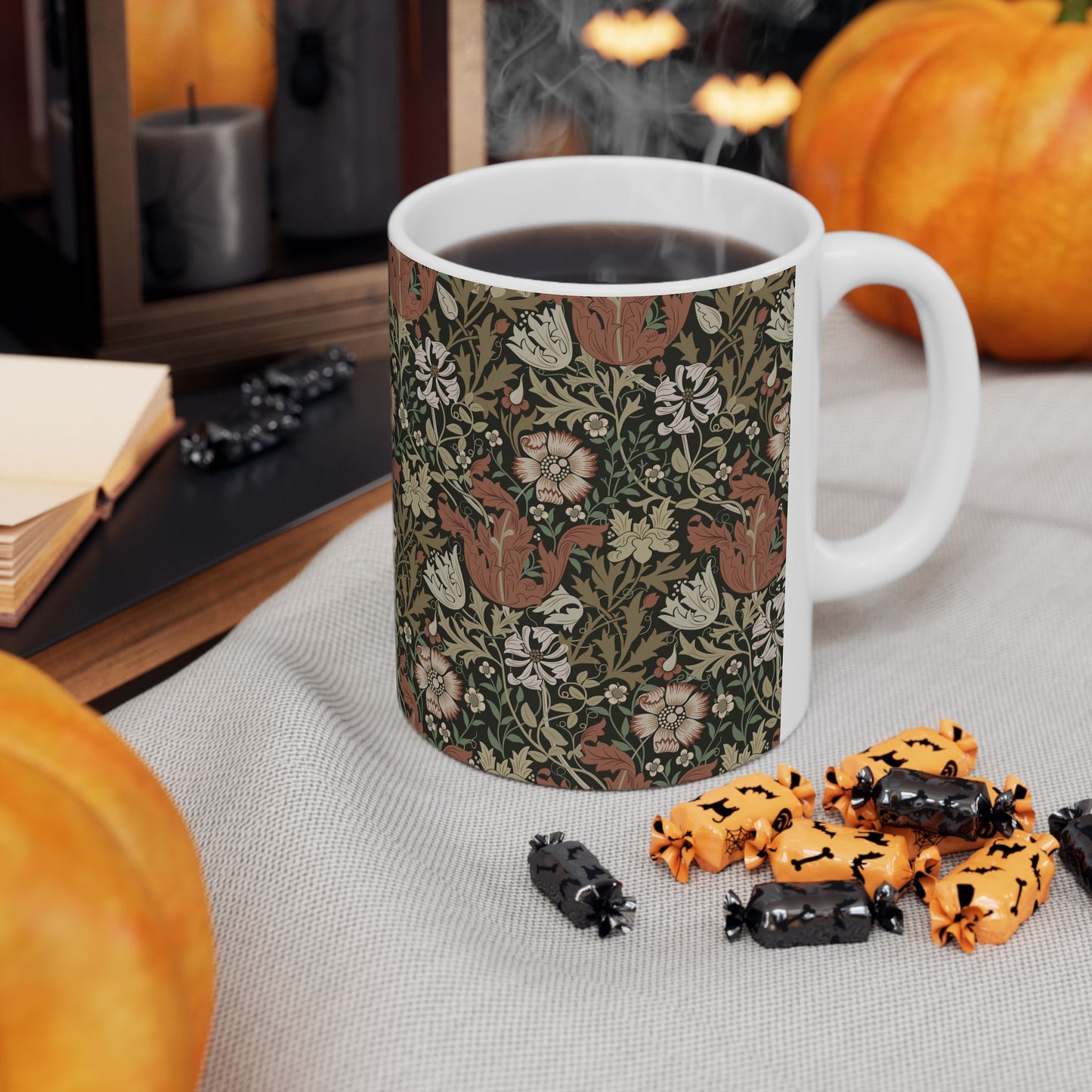 A white ceramic mug with a floral Arts & Crafts pattern called Compton which was inspired by William Morris & Co