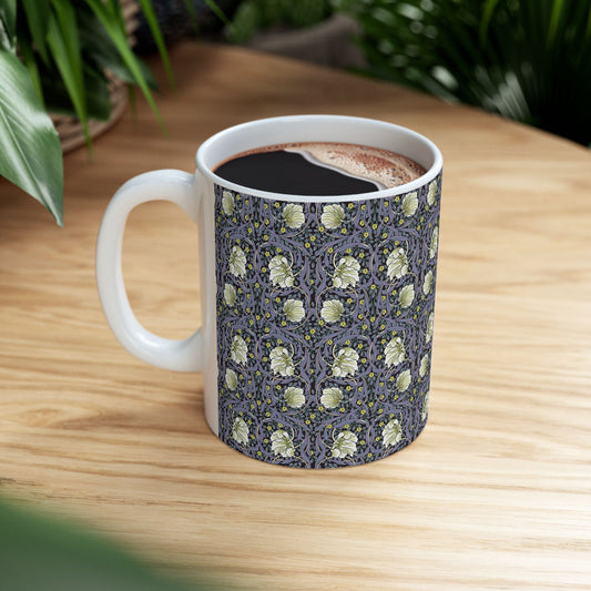 A ceramic mug with a floral pattern inspired by William Morris - Pimpernel Collection in lavender colour.