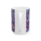 A white ceramic mug with a pink floral seaweed pattern inspired by William Morris.