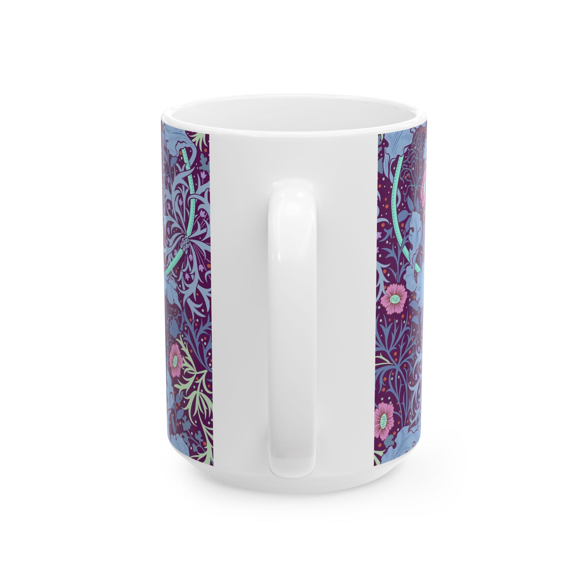 A white ceramic mug with a pink floral seaweed pattern inspired by William Morris.