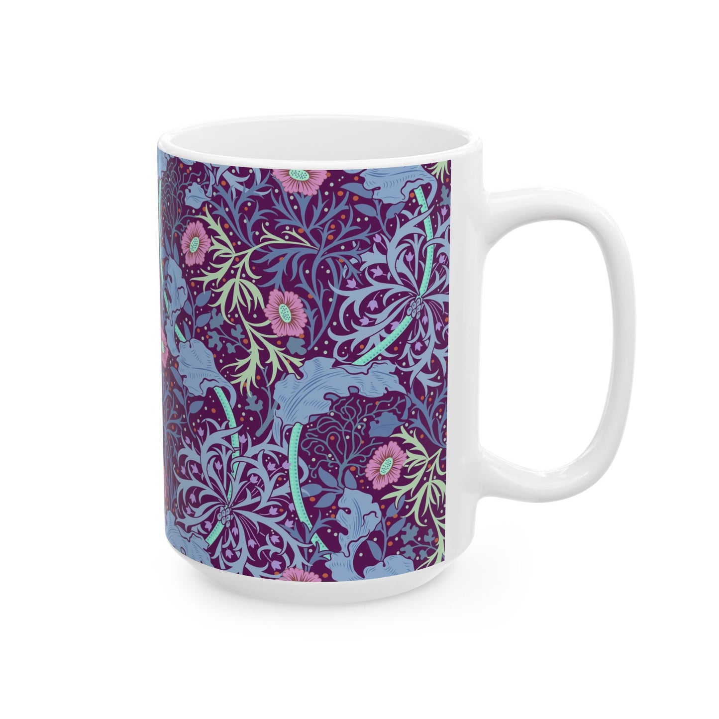 A white ceramic mug with a pink floral seaweed pattern inspired by William Morris.