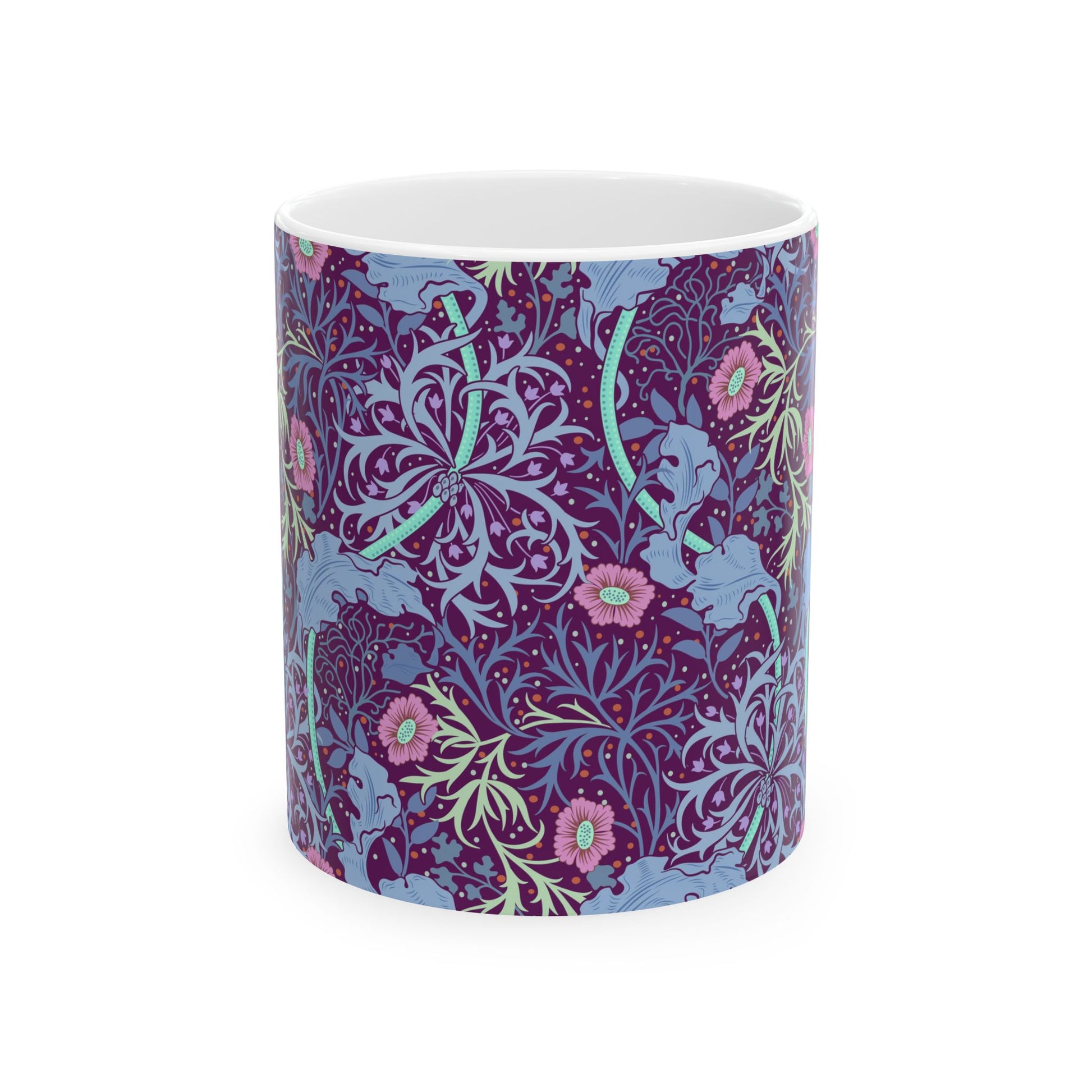 A white ceramic mug with a pink floral pattern inspired by William Morris.