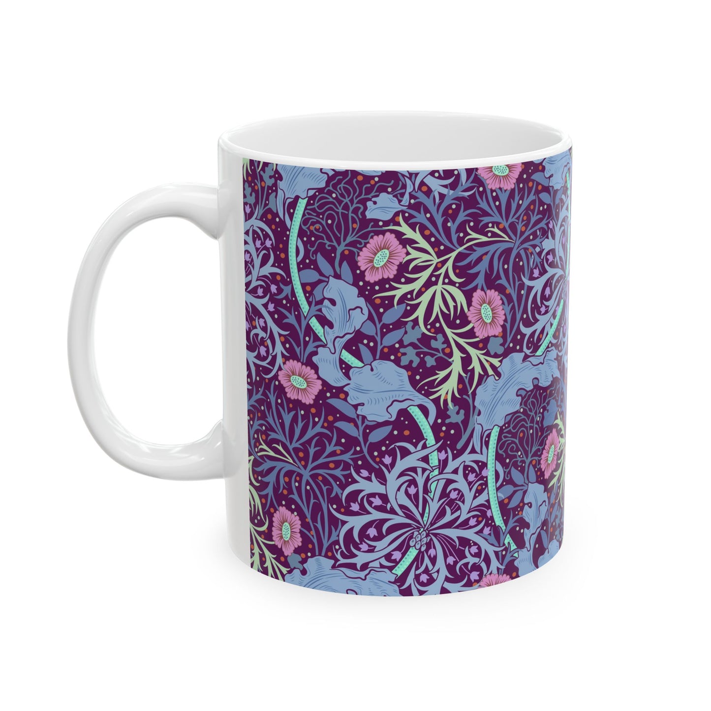 A white ceramic mug with a pink floral seaweed pattern inspired by William Morris.