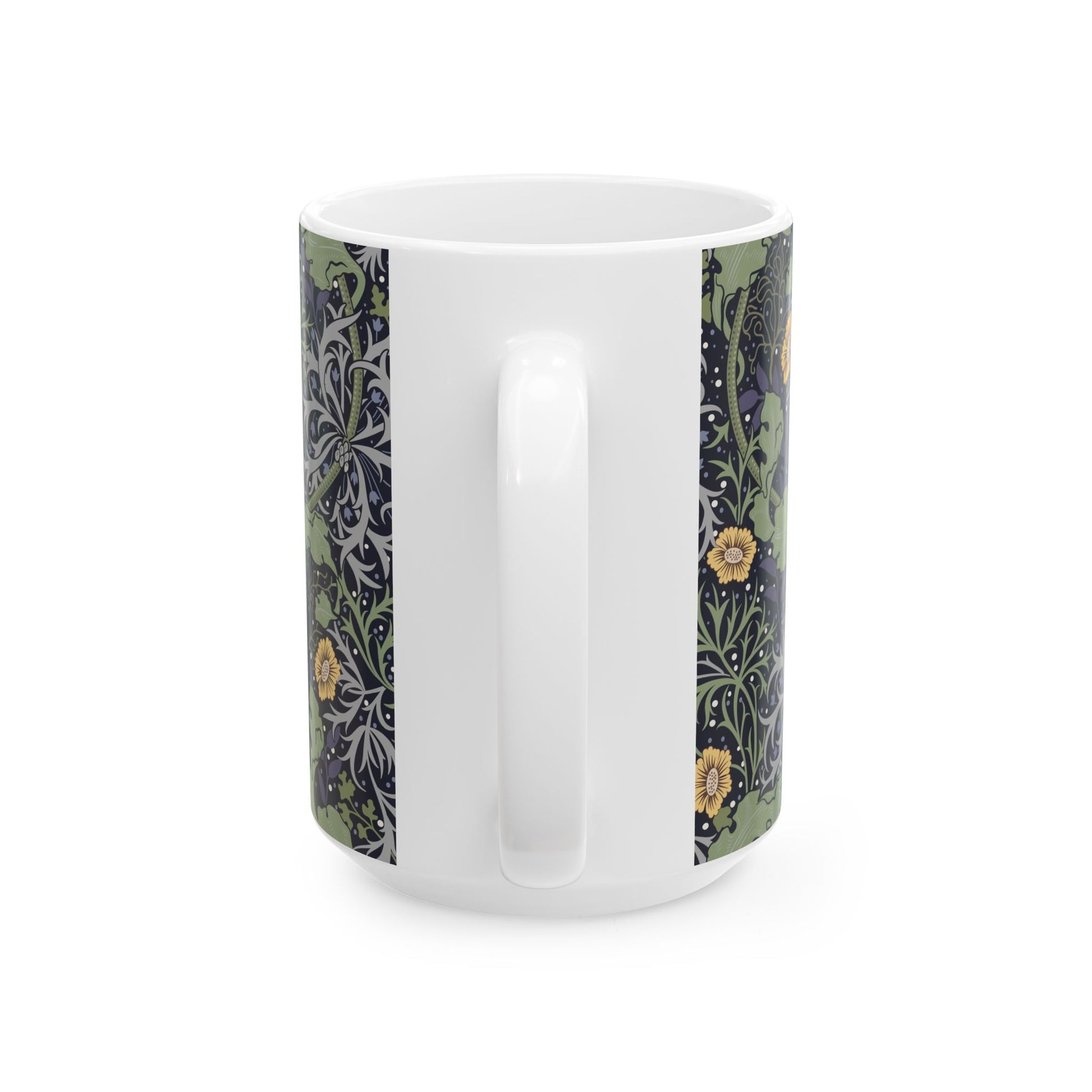 A white ceramic mug with a yellow and green floral pattern from the Collection called Seaweed inspired by William Morris.