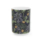 A white ceramic mug with a yellow and green floral pattern from the Collection called Seaweed inspired by William Morris.
