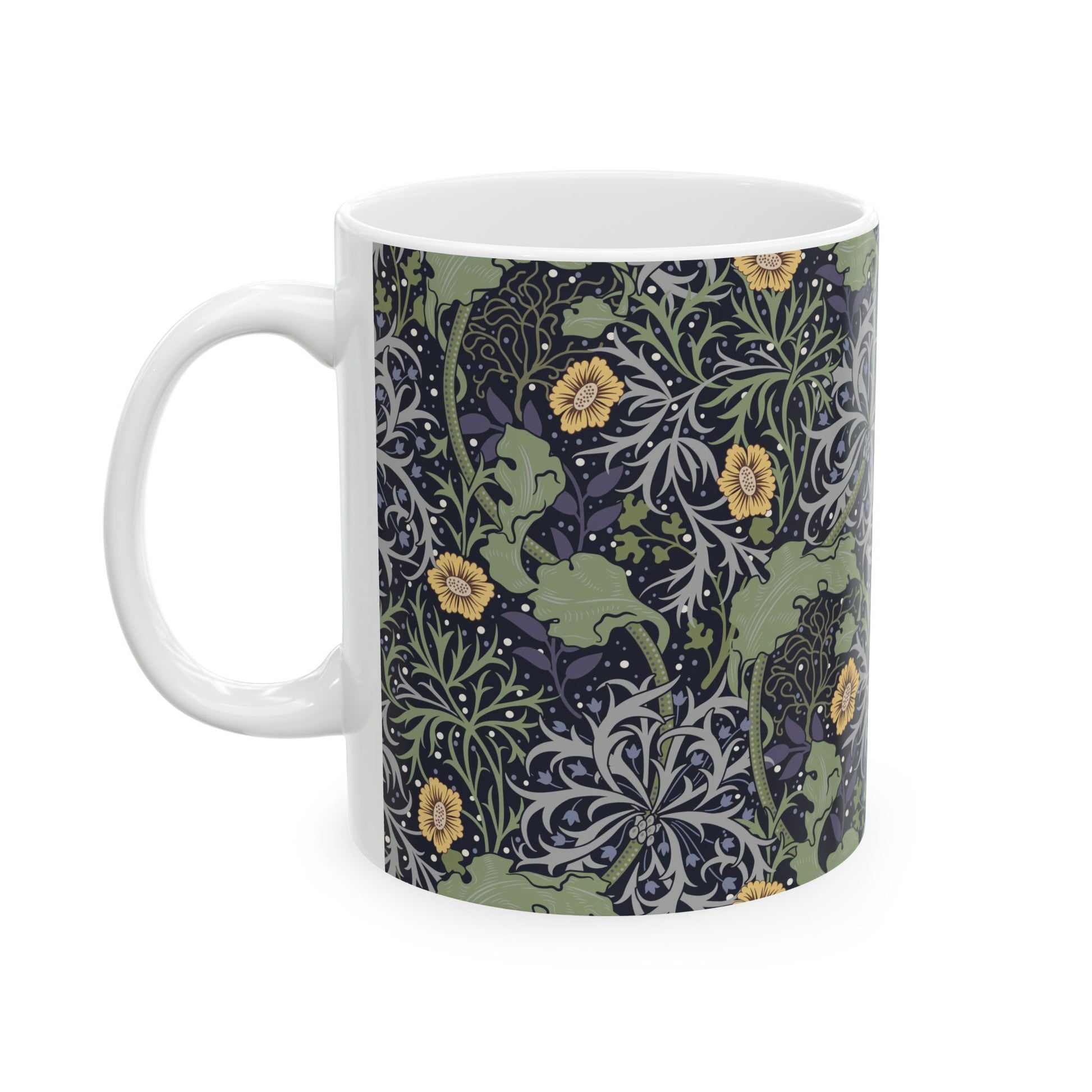 A white ceramic mug with a yellow and green floral pattern from the Collection called Seaweed inspired by William Morris.