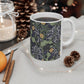 A white ceramic mug with a yellow and green floral pattern from the Collection called Seaweed inspired by William Morris.