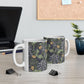 A white ceramic mug with a yellow and green floral pattern from the Collection called Seaweed inspired by William Morris.