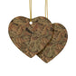 Two heart-shaped decorative items with leaf pattern on a white background