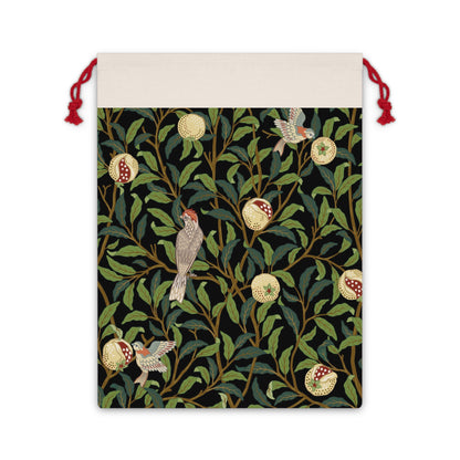 A Christmas Santa Sack with a bird and pomegranate design, inspired by William Morris, in Onyx colour.