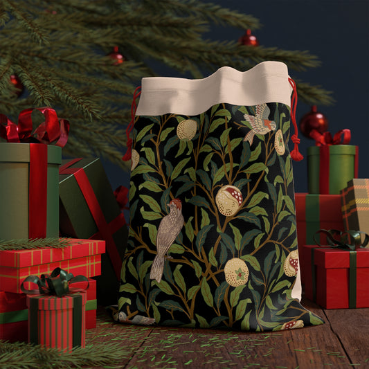 A Christmas Santa Sack with a bird and pomegranate design, inspired by William Morris, in Onyx colour.