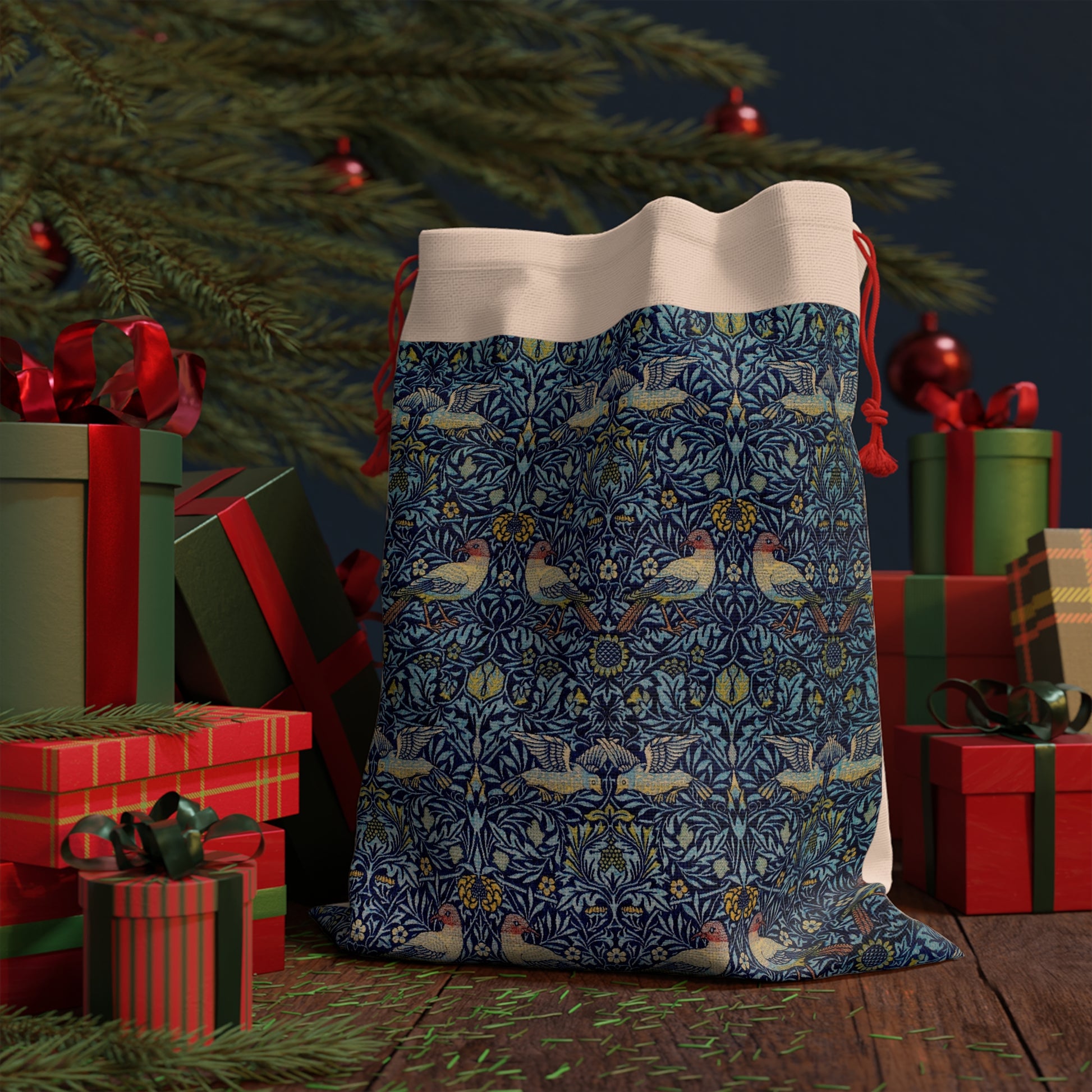 Blue patterned drawstring bag with Christmas presents and tree in the background