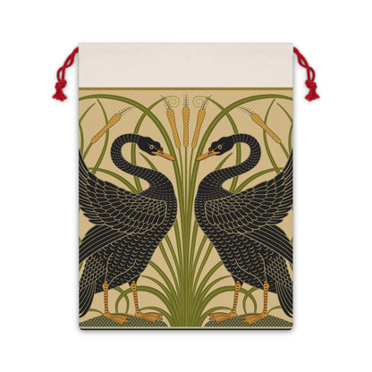 Decorative artwork on a santa sack of two black swans with green reeds and yellow flowers on a beige background.