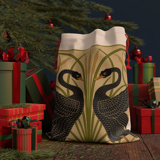 Decorative artwork on a santa sack of two black swans with green reeds and yellow flowers on a beige background.