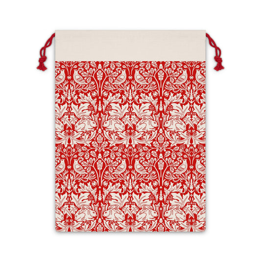 Christmas linen drawstring bag with red and white floral William Morris & Co pattern on a beige background