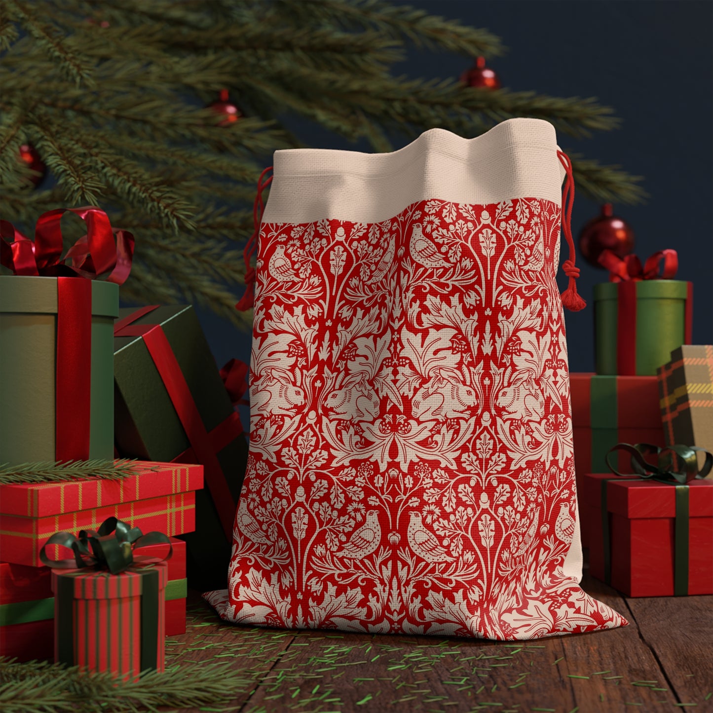 Christmas linen drawstring bag with red and white floral William Morris & Co pattern on a beige background