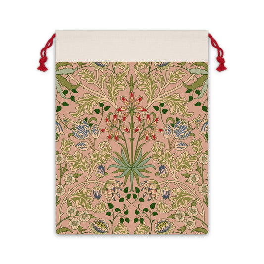 A rectangular Christmas Santa Sack with a floral pattern inspired by William Morris, in colors pink, green, and red, with a white top and red drawstrings.