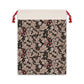 A rectangular Christmas-themed linen drawstring bag with a floral pattern in a mocha colour, inspired by the William Morris design.