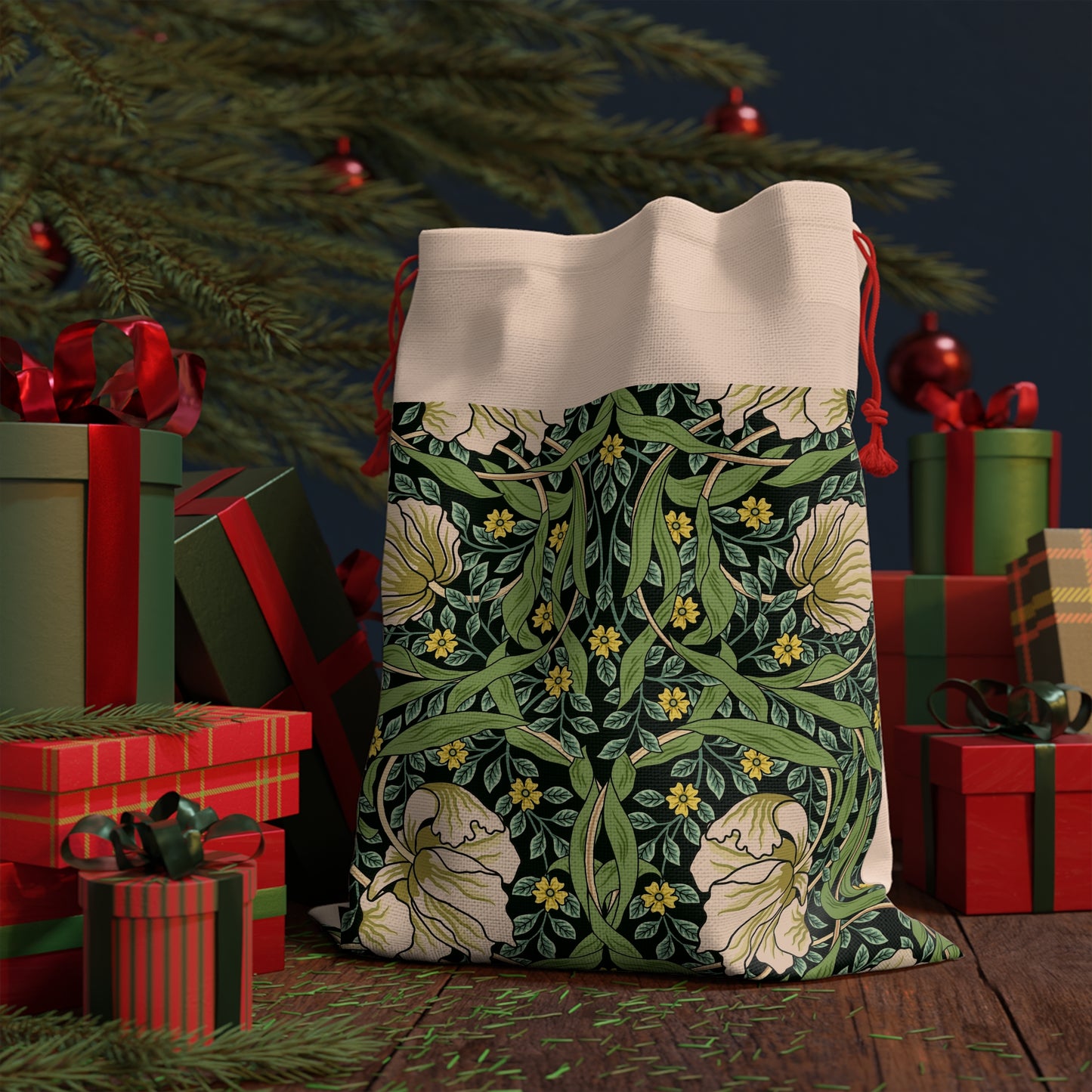 A rectangular Christmas Santa sack with a floral pattern inspired by William Morris - Pimpernel Collection in green, beige, and red colours with a red drawstring at the top.