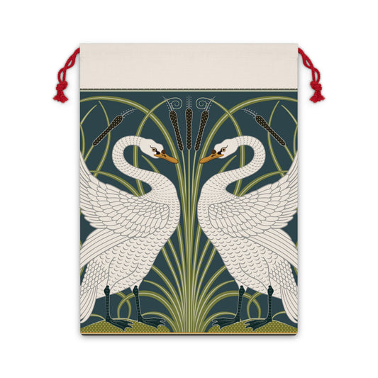 A Christmas-themed linen drawstring bag with a vintage William Morris & Co design featuring white swans on a green and blue background, finished with red drawstrings.