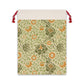 A rectangular Christmas-themed linen drawstring bag with a floral pattern in beige, green, and orange colours, featuring a red drawstring at the top.