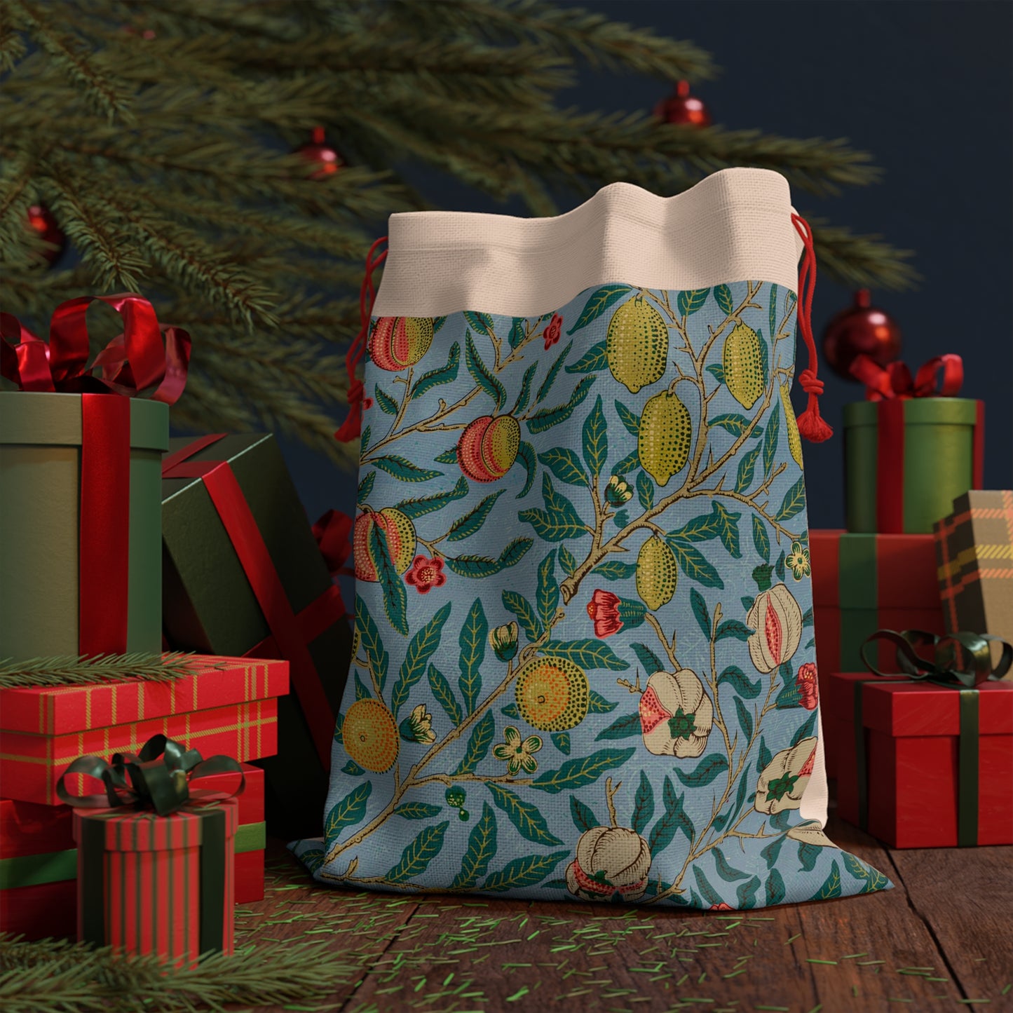A Christmas Santa Sack with a blue background featuring a floral and fruit pattern, inspired by William Morris, with red drawstrings.