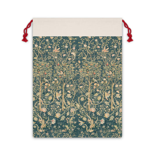 A Christmas Santa sack with a floral William Morris & Co pattern in green, beige, and gold colours, featuring a white drawstring and red ties.