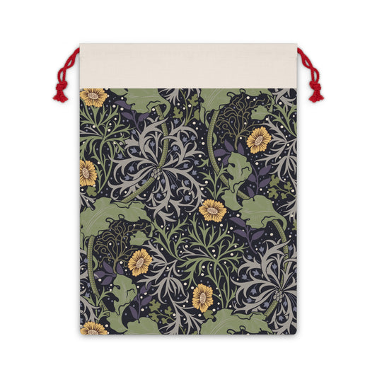 A Christmas Santa Sack with a yellow flower and seaweed pattern, inspired by William Morris, with red drawstrings.