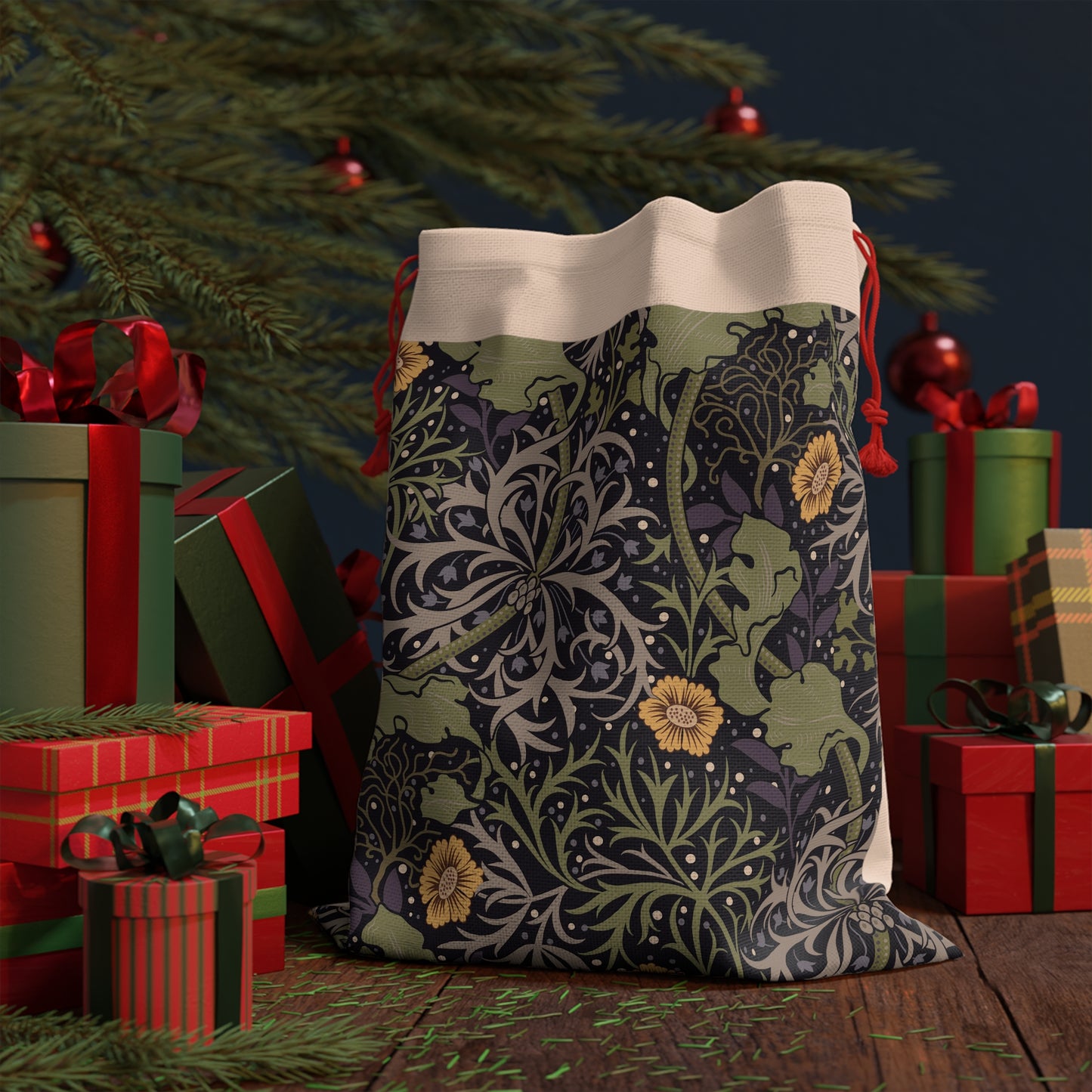 A Christmas Santa Sack with a yellow flower and seaweed pattern, inspired by William Morris, with red drawstrings.