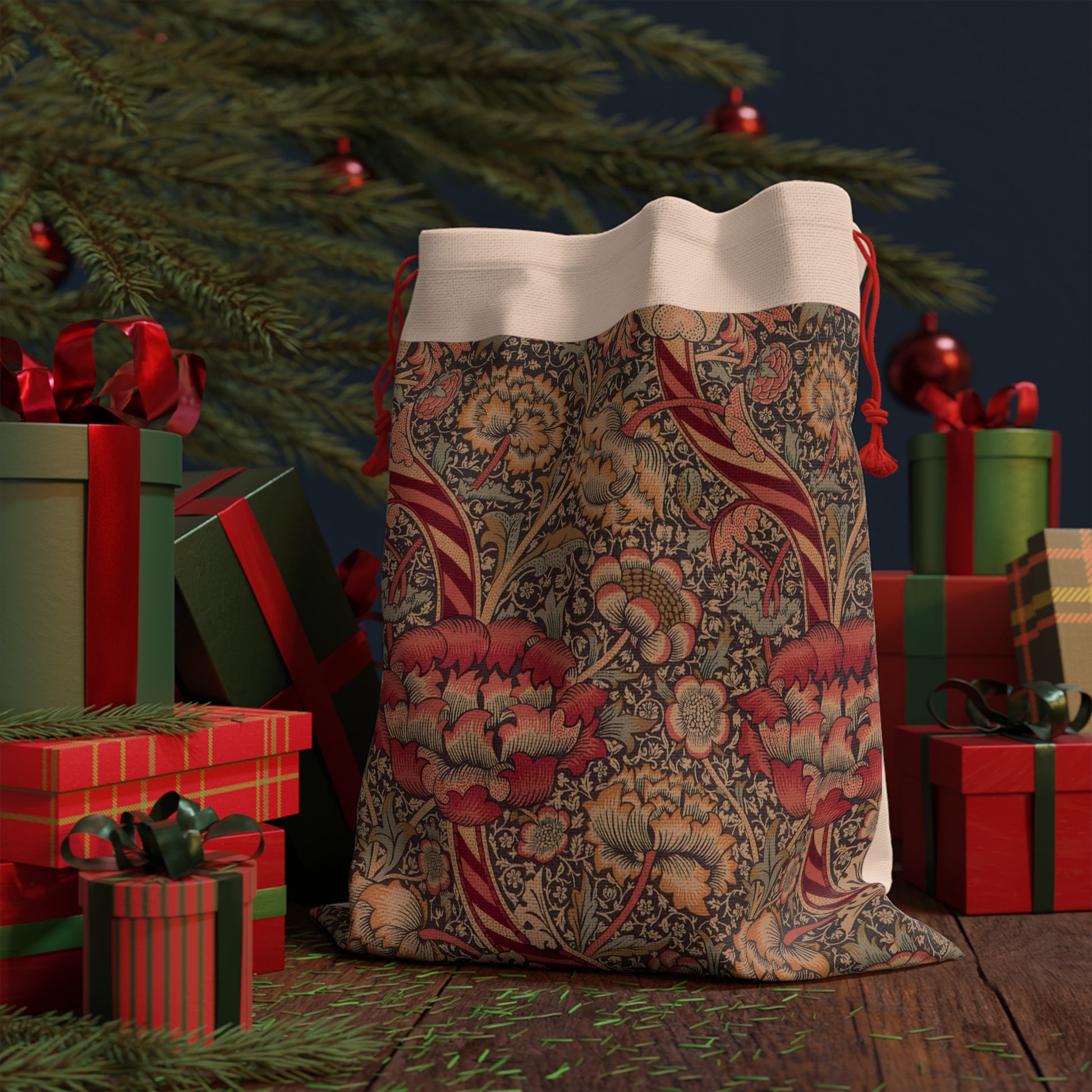 A rectangular Christmas Santa sack with a floral pattern inspired by William Morris - Wandle Collection in red, green, and beige colours, featuring a polyester drawstring at the top.