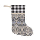 Decorative stocking with black and white checkered top and floral patterned bottom on a white background