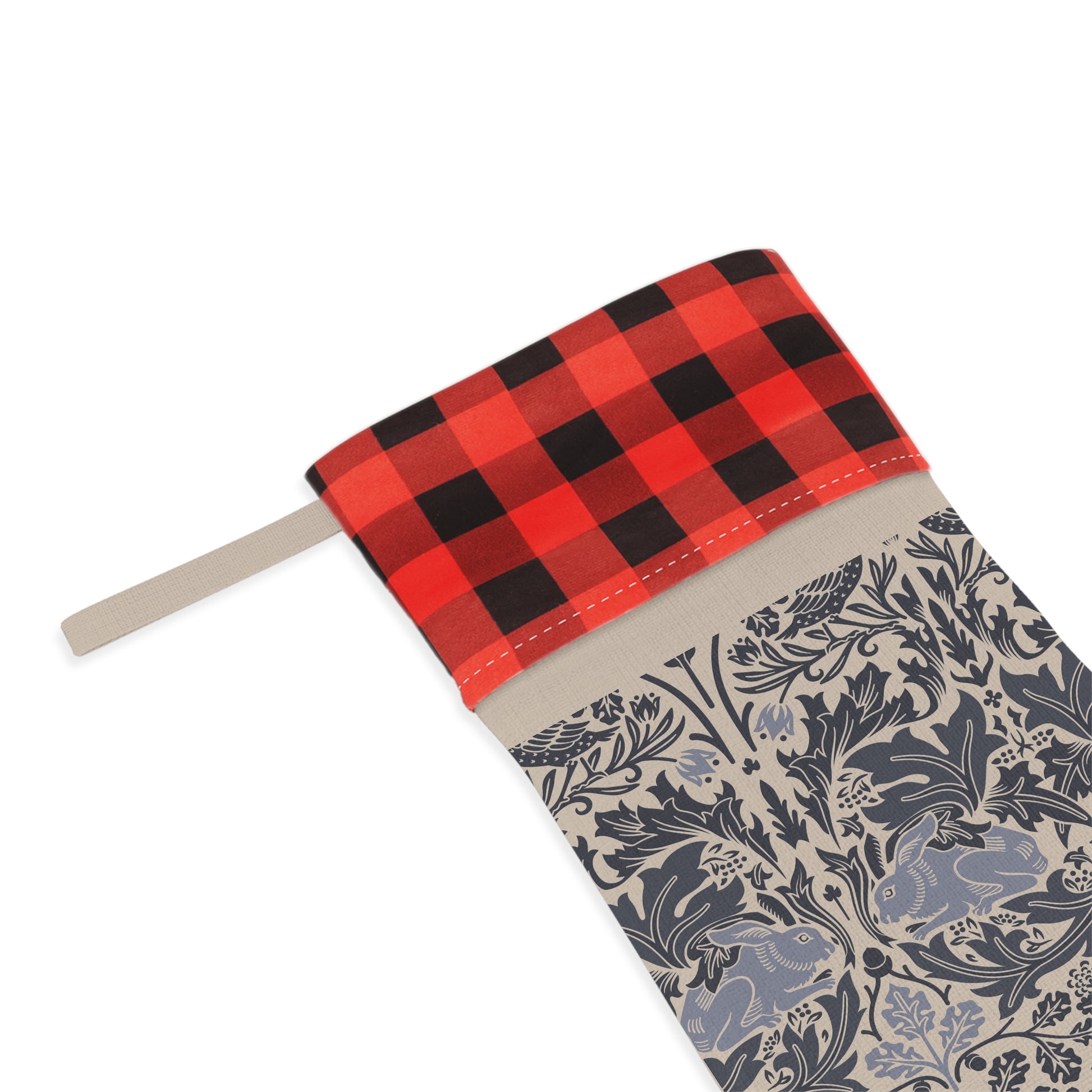 Fabric swatch with red and black plaid pattern on top and blue and beige floral pattern below on a white background.