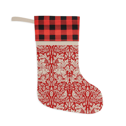 Decorative Christmas stocking with red and white pattern and black and red checkered top on a white background