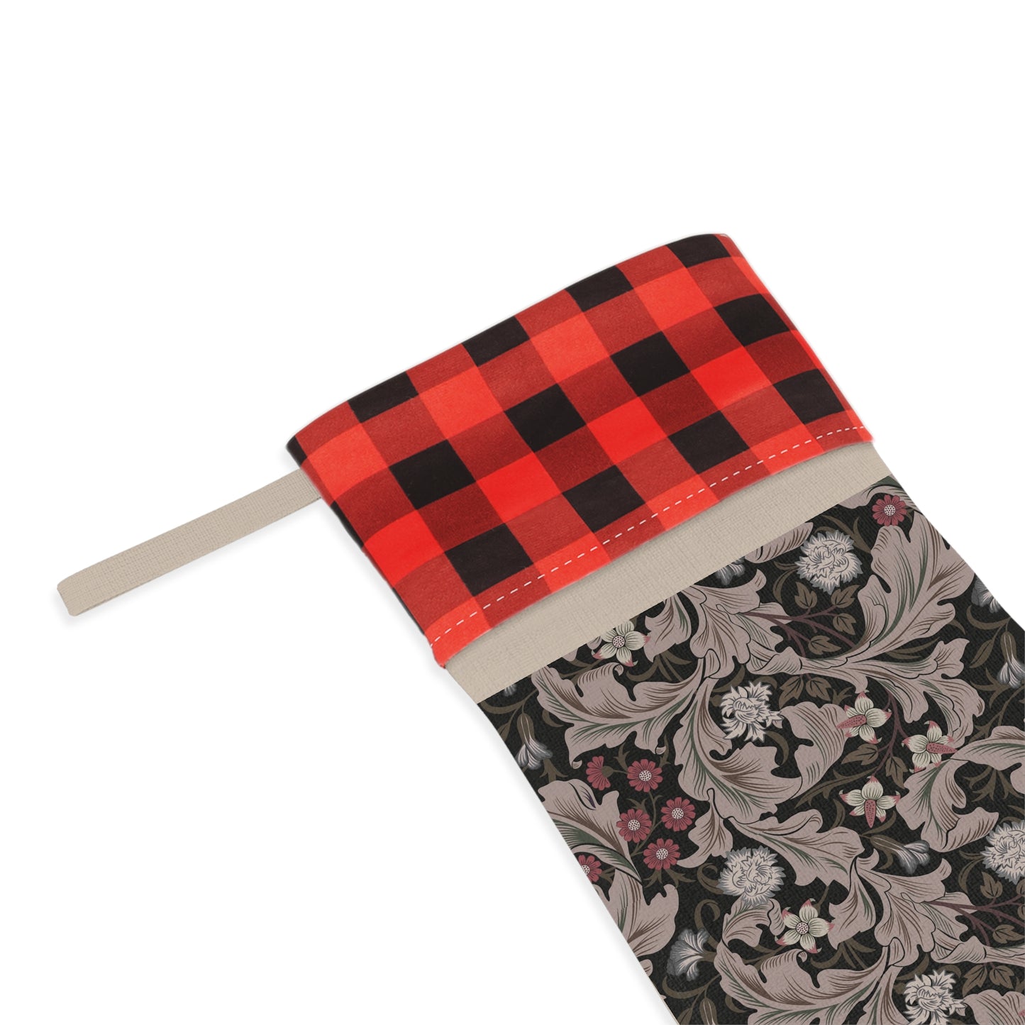 A Christmas stocking with a floral pattern in a red and black or white and black checkered design, featuring a wooden hanging loop.