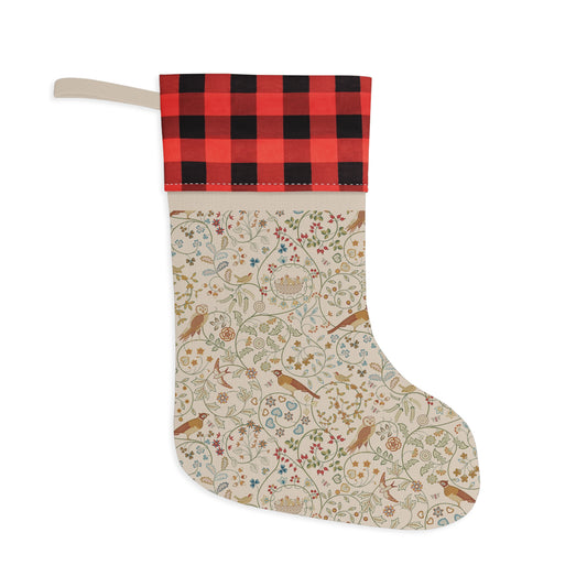 Decorative Christmas stocking with red and black plaid top on a white background
