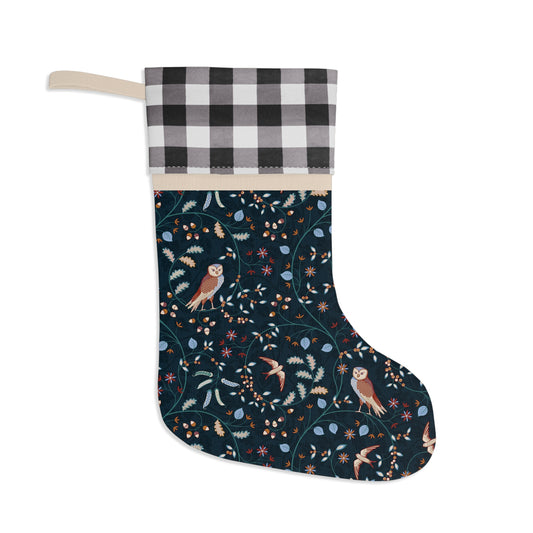 Christmas stocking with owl and floral pattern on a dark background
